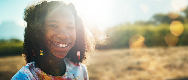 Black girl child, outdoor portrait and mockup space by field, grass or nature for holiday in blurred background. Young happy female, sunshine and excited smile at park, safari or countryside vacation