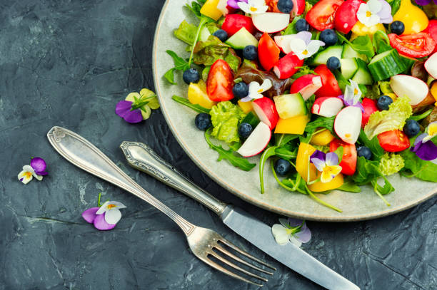 istock Tasty summer salad with edible flowers 1496138501