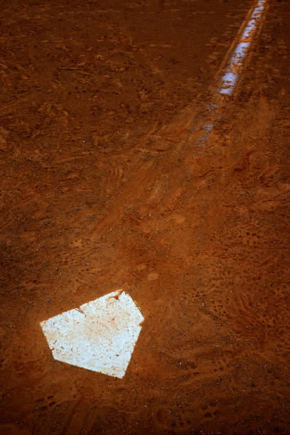 istock Baseball Diamond Base or Plate White Against Dark Dirt for Competition and Playing Game 1496140596