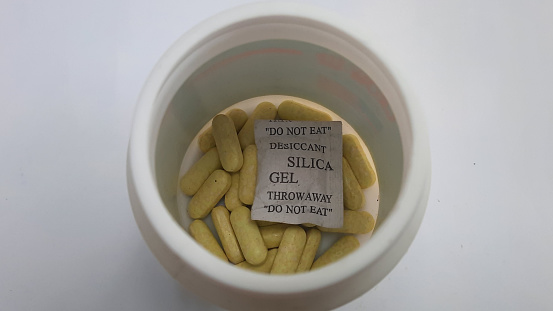 Desiccant or silica gel in paper packaging, in supplement tablet medicine
