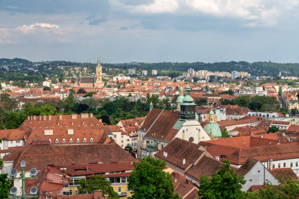 Marvel at the captivating cityscape of Graz, Austria, where the past seamlessly blends with modernity. This panoramic view showcases the architectural beauty and vibrant atmosphere of this European gem. The skyline of Graz is adorned with a mix of historic and modern buildings, creating a visual feast for the eyes.