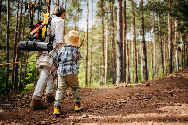 istock Mother and son hiking in forest 1496144771