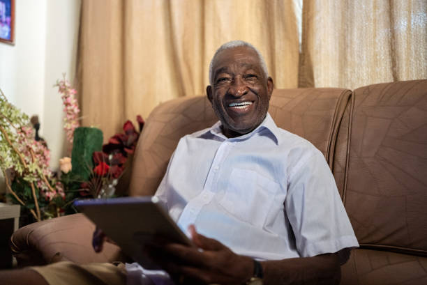 istock Portrait of a senior man using digital tablet at home 1496145003