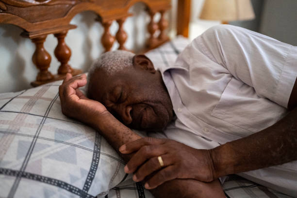 istock Senior man sleeping in the bedroom at home 1496145120