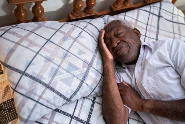 istock Senior man sleeping in the bedroom at home 1496145143