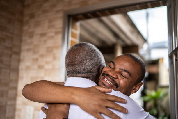 istock Son welcoming father at home 1496145422