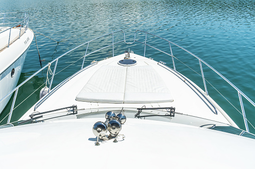 View of the bow of a snow-white yacht, an area for recreation, leisure, tourism and travel by sea