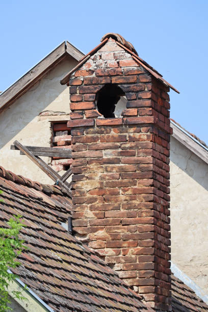 istock Brick smoke stack of an old house 1496152505
