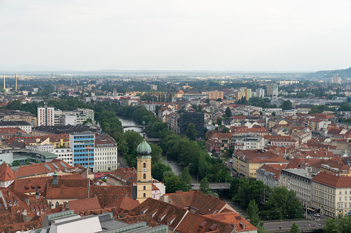 Marvel at the captivating cityscape of Graz, Austria, where the past seamlessly blends with modernity. This panoramic view showcases the architectural beauty and vibrant atmosphere of this European gem. The skyline of Graz is adorned with a mix of historic and modern buildings, creating a visual feast for the eyes.