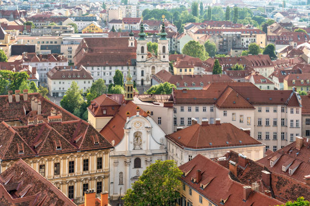 Marvel at the captivating cityscape of Graz, Austria, where the past seamlessly blends with modernity. This panoramic view showcases the architectural beauty and vibrant atmosphere of this European gem. The skyline of Graz is adorned with a mix of historic and modern buildings, creating a visual feast for the eyes.