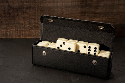 White dominoes on a black background.