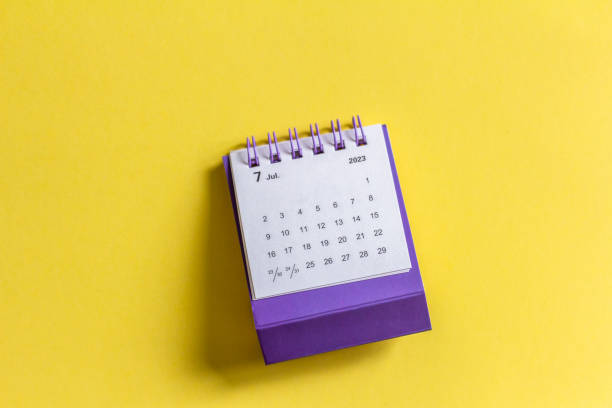 istock July 2023, monthly desktop calendar for 2023 bright yellow background. 1496154821