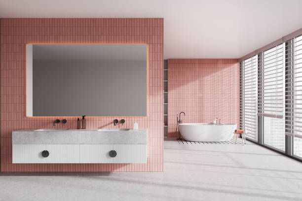 istock Pink tile bathroom with tub and double sink 1496156098