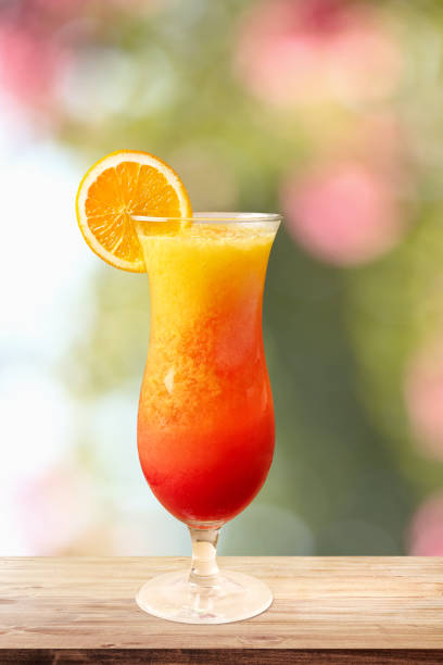 Glass of fresh fruit juice cocktail Close up frozen fruit juice tequila sunrise stock pictures, royalty-free photos & images