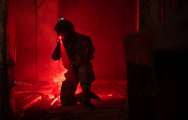 Soldier in warfare in a dark building.