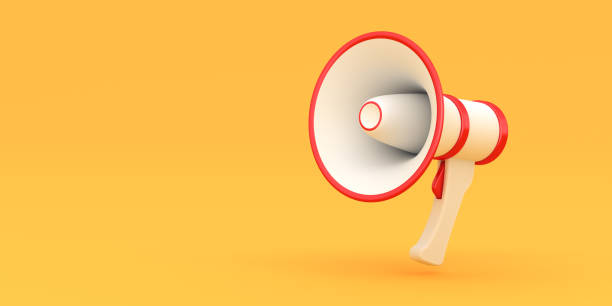 istock White megaphone with red stripes isolated on yellow background 1496160433