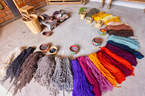 Teotitlán del Valle, its wool rugs and yarns, colored in a traditional way.\nThe coloring of these skeins of wool must be by means of natural dyes obtained from plants and insects such as: huizache, indigo, cochineal, indigo, rock moss, zempaxuchitl flower, among others.