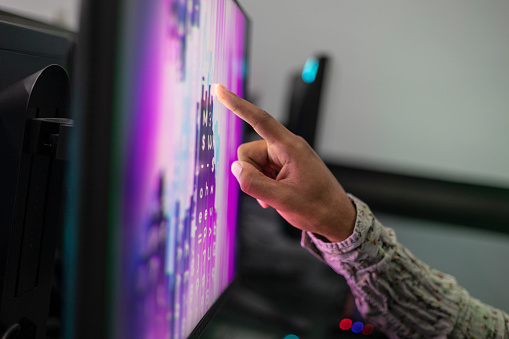 Black male hand pointing on a screen