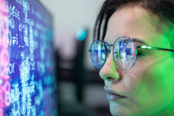 istock White woman's face with glasses in front of a screen 1496162736
