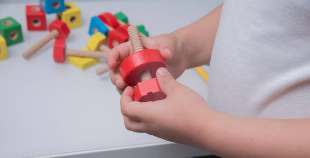 istock Board game constructor. Wooden parts for the constructor game. Education. Entertaining games for children.Kindergarden education games.close up view 1496162784