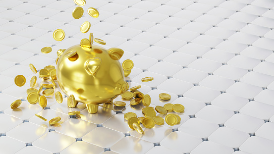 Golden piggy bank and falling coins. Savings, financial business and economy concept.