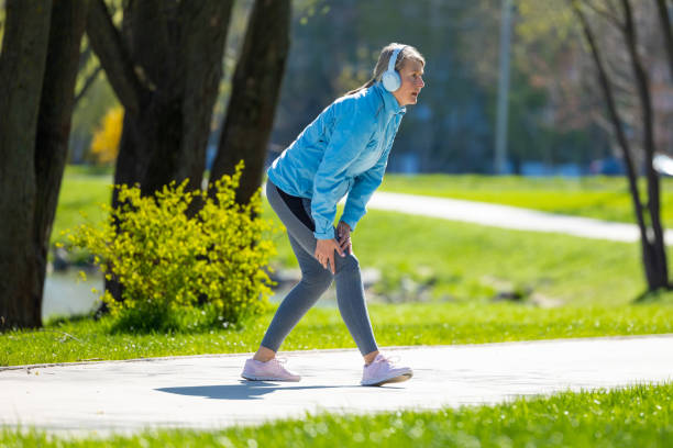 istock Woman in blue blazer doing leanings in the park 1496169689