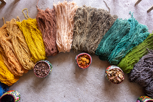 Teotitlán del Valle, its wool rugs and yarns, colored in a traditional way.\nThe coloring of these skeins of wool must be by means of natural dyes obtained from plants and insects such as: huizache, indigo, cochineal, indigo, rock moss, zempaxuchitl flower, among others.