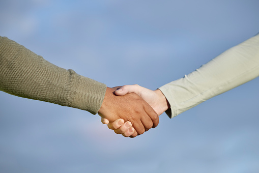 Handshake, agreement and people teamwork, partnership and collaboration for support, onboarding and b2b on blue sky. Woman with partner shaking hands together for welcome, thank you or deal on mockup