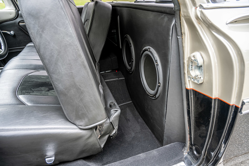 Subwoofer speaker box is behind the drivers seat of the classic 1959 El Camino car for very loud music from the stereo.