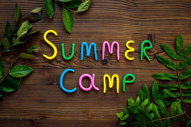 istock Summer Camp made of clay with green tree branches. Forest kids camp concept 1496173392