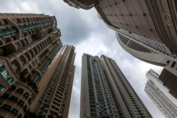 A stunning view of urban construction amidst lush greenery, with impressive skyscrapers in the background