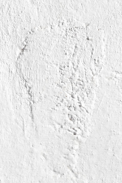 istock White wall texture with elongated roughness in center. Vertical. 1496175278