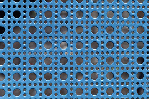 Blue metal grid, full of holes. Ideal for making textures.