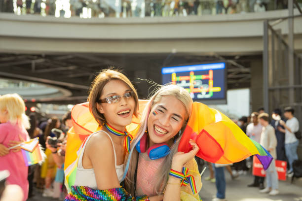Happy Asian friend having fun in the street LGBTQ pride parade. Happy Asian friend having fun in the street LGBTQ pride parade bangkok thailand gay pride people stock pictures, royalty-free photos & images
