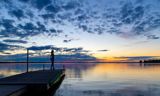 istock Woman on a boat dock 1496176222