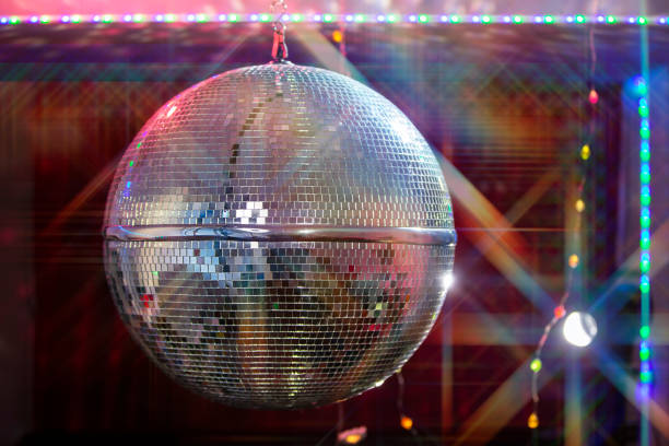istock Disco ball with bright beams, night party background photo. 1496178042