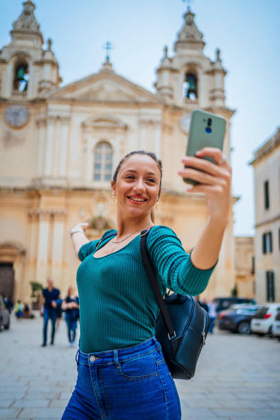 istock Young woman having a video call in Mdina, Malta 1496178067