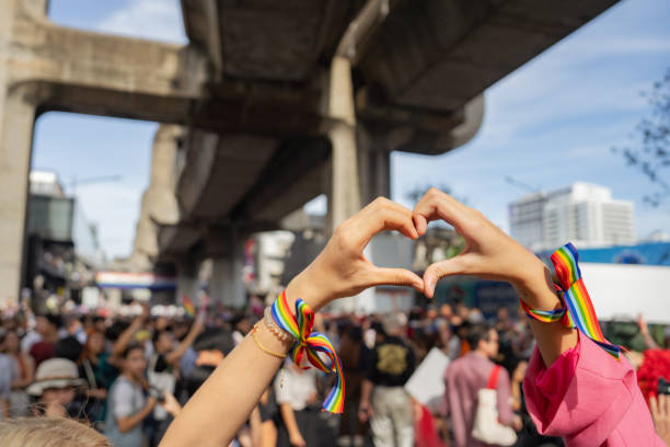 istock LGBT friends hands making heart shape in LGBT pride parade 1496178136