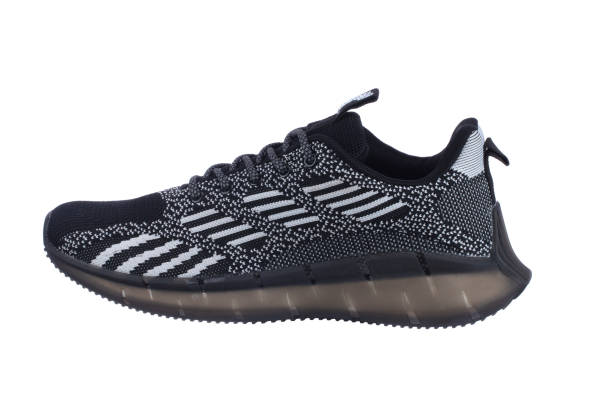istock Black rag sneaker with gray stripes on a white background. 1496178160