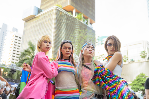 LGBTQ+ friends enjoying the Pride Parade in Bangkok