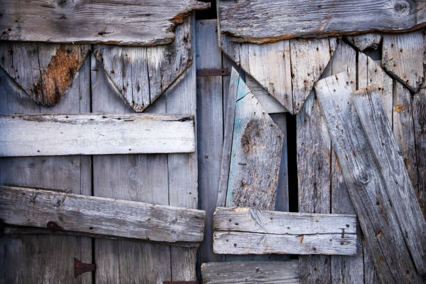 Taos, NM: Antique Wooden Door Detail with Rusty Door Pull. Close-up shot.