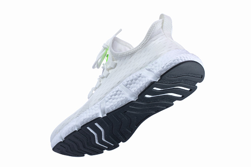 White sneaker made of fabric with a black sole on a white shoe.