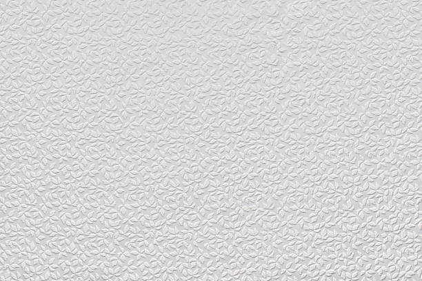istock White paper wallpaper texture with abstract floral repeating pattern. Plastered embossed wall. 1496180909