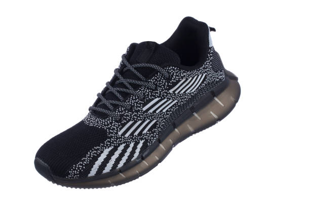 istock Black rag sneaker with gray stripes on a white background. 1496180972