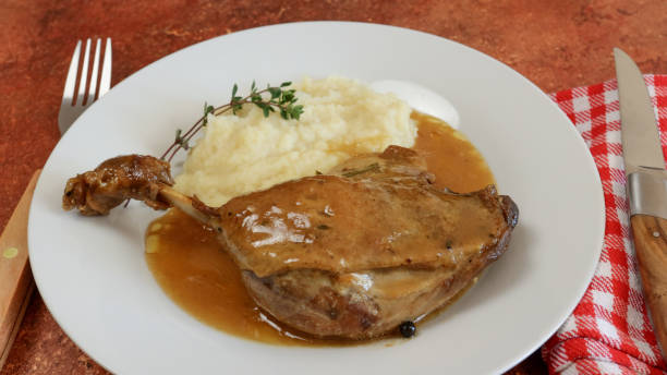 istock confit duck leg with pepper sauce and puree 1496181161