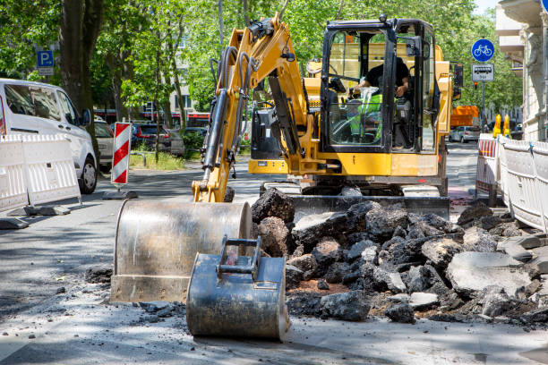 istock Road works - excavator tears up the road 1496181595