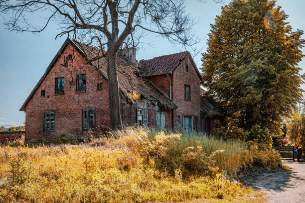 Old ruined and abandoned old brick house. Old traditional village English architecture