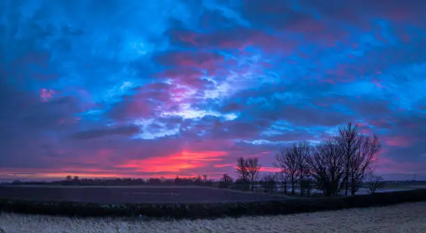 Flat land and big skies, some of the best sunrises and sunsets in the world can be found on the Fens near Spalding in Lincolnshire in Eastern England.