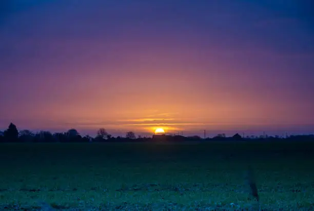 Flat land and big skies, some of the best sunrises and sunsets in the world can be found on the Fens near Spalding in Lincolnshire in Eastern England.