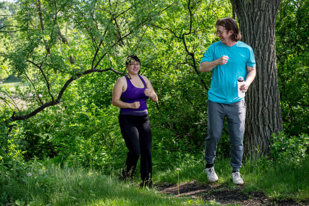 istock Running in Sync: Adventure and Togetherness in the Forest 1496183033